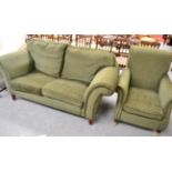 A modern green easy chair and sofa