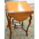 A 19th century mahogany occasional table with four drop leaves and galleried shelf stretcher