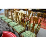 A set of eight walnut dining chairs (6+2)