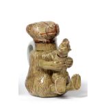 A Pratt Type Pottery Bear Jug and Cover, circa 1800, naturalistically modelled holding a dog in