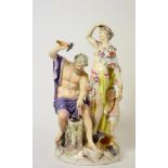 A Berlin Porcelain Figure Group, late 19th century, as Vulcan sitting at an anvil, Venus and Cupid