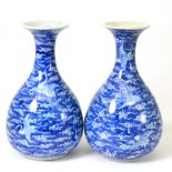 A Pair of Chinese Porcelain Bottle Vases, 19th century, painted in underglaze blue with cranes