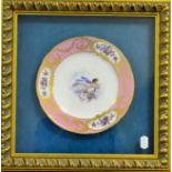 A Sèvres Style Porcelain Plate, in 18th century style, painted with a cherub amongst clouds within a