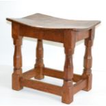 A 1940s Robert ''Mouseman'' Thompson Burr Oak Dish Top Stool, the adzed top on four octagonal legs