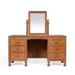 A Robert ''Mouseman'' Thompson Panelled Oak Dressing Table, with rectangular fixed central mirror,