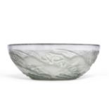 A René Lalique Chiens Clear and Frosted Glass Bowl, with blue staining, moulded with a frieze of