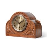 A Robert ''Mouseman'' Thompson Oak Mantel Clock, the arched top case with triangular repeating