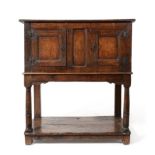 A Joined Oak Livery Cupboard, late 17th/early 18th century, with two fielded cupboard doors,