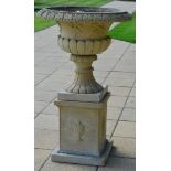 A Cast Stone Campana Urn on Stand, 20th century, of semi-fluted form, the everted rim with