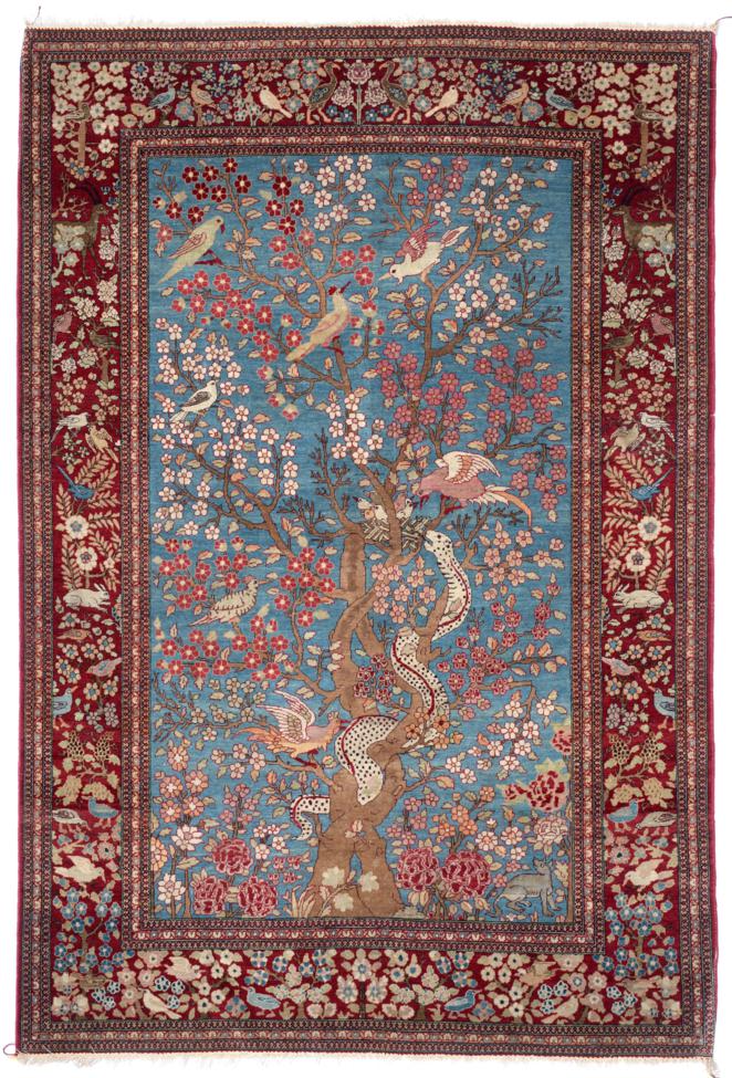 Fine Isfahan Rug Central Persia The pale indigo field centred by a Tree of Life and exotic birds