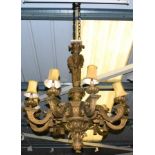 A Gilt Carved Wood and Gesso Nine-Light Chandelier, in 17th century style, the tricorn column with