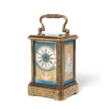 A Miniature Brass and Porcelain Mounted Engraved Carriage Timepiece, circa 1890, carrying handle,