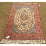 Isfahan Rug Central Iran The cream field of palmettes and vines centred by a crimson and ice blue