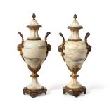 A Pair of Gilt Metal Mounted Marble Urns and Covers, circa 1900, of baluster form with mask