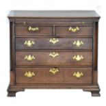 A George III Oak Straight Front Chest of Drawers, 3rd quarter 18th century, with pull-out brushing