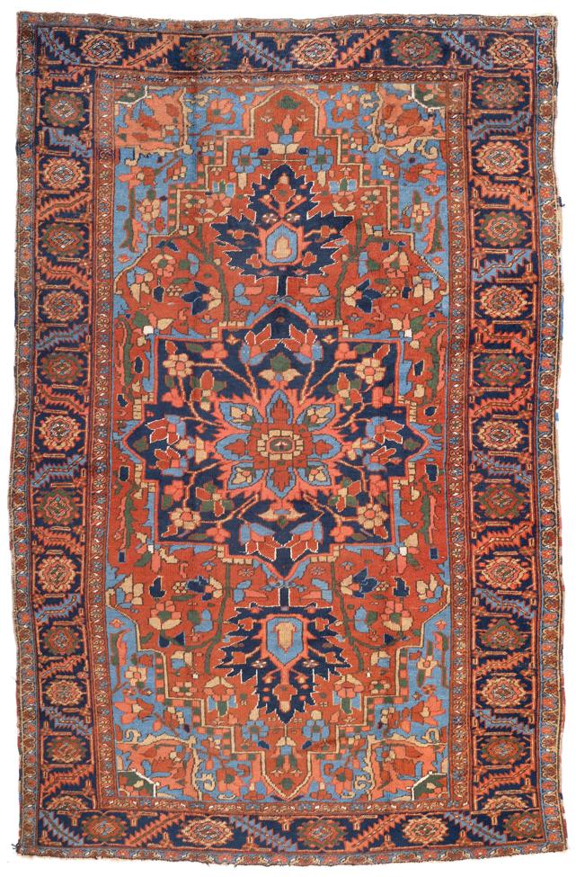 Heriz Carpet Persian Azerbaijan, circa 1910 The terracotta field of angular vines around an indigo