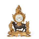 A Fine Bronze Ormolu Striking Mantel Clock, circa 1870, surmounted by a lady in robes holding a