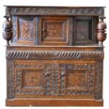 A Carved Oak and Marquetry Inlaid Court Cupboard, carved with initials GDC and dated 1674, the