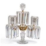 A Regency Gilt Bronze and Cut Glass Two-Light Candelabrum, with central foliate finial on stiff leaf