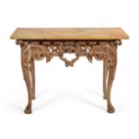 A Carved Pine Side Table, in George I style, the yellow Sienna marble top above an acanthus and