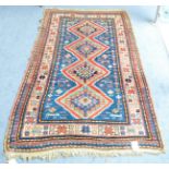 Small Kazak Rug Central Caucasus The indigo field with a column of stepped and hooked medallions