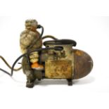 A Vintage Michelin Tyre Compressor, in the shape of an artillery shell surmounted by a cast