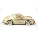 Porsche Interest: A Scale Model of a Porsche 911, the base stamped STERLING 925, with perspex