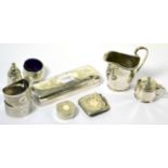 A selection of silver items comprising milk jug, rectangular box, vesta case, two napkins rings,