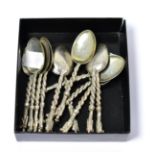 A set of twelve Chinese export silver spoons, each with a naturalistic twisted stem and marked