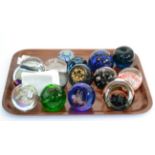 Thirty-one assorted glass paperweights (on two trays)