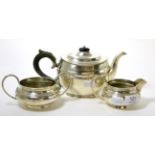 A matched three piece silver tea service 32.5ozt