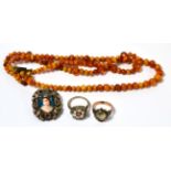 Amber coloured bead necklace, a Victorian ring stamped 9ct, millefiori ring and a Limoges brooch