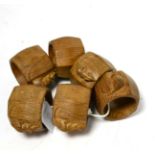 A set of six Robert ''Mouseman'' Thompson oak napkin rings, each with carved mouse signature, 4cm