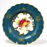 A Royal Worcester fruit painted plate signed E Phillips Slight wear to gilding on rim. One or two