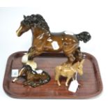 Two Beswick horses and a Beswick donkey Light crazing to each piece, but all appear good,