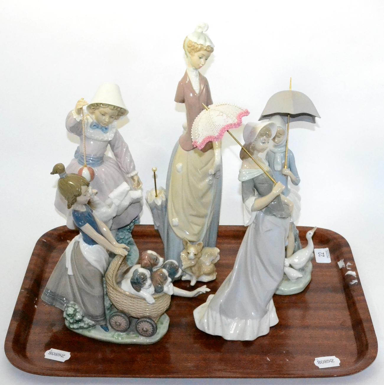 Five various Lladro figures, elegant ladies with parasols etc One figure with arm broken off but