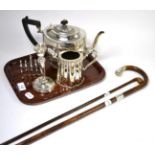 A silver four division toast rack, silver candlestick, silver mounted partridge wood cane, another
