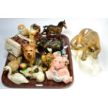 A tray of pottery models including a large Beswick model of a mountain lion, Beswick horses, birds