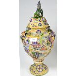 A Japanese earthenware moriage ware vase and cover, decorated in bright enamels with figures and