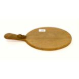 A Robert ''Mouseman'' Thompson oak cheese board Generally good condition