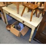 A painted pine farmhouse side table fitted with two drawers