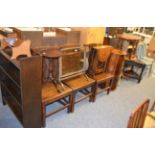 A group of furniture including a set of three George III oak plank seated dining chairs, two oak