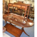 A reproduction dining table with matching bow fronted sideboard and a walnut washstand