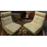 A pair of Italian leather and chrome swivel chairs