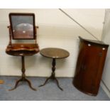 A Georgian mahogany bow front corner cupboard, two Georgian oak tripod tables and a Victorian