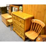 A filing cabinet, a pine blanket box, a large pine mirror, pine chest of drawers and two pine slat