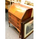 A 1930's veneered writing desk