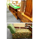Ottoman day bed and an open mahogany bookcase/stereo unit