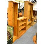 A large pine free standing bookcase and two other pine bookcases