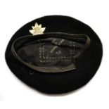 A Second World War Canadian Special Forces Kangol Beret, dated 1945 and with rare white metal